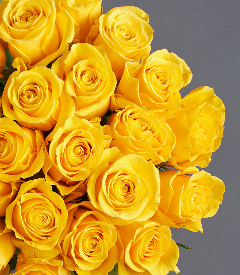 A luxurious bouquet of vibrant yellow roses, showcasing their fresh, elegant petals for premium