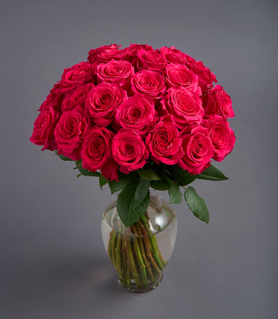 Hot pink rose dome arrangement in clear glass vase, premium birthday flowers