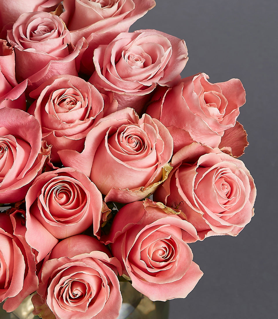 Pink rose mini basket with layered blooms for birthday gifting