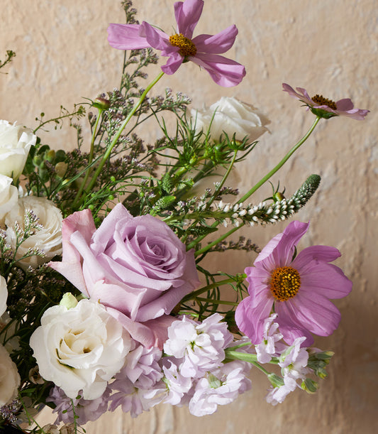 Lavender and white rose vase arrangement with cosmos and lisianthus flowers