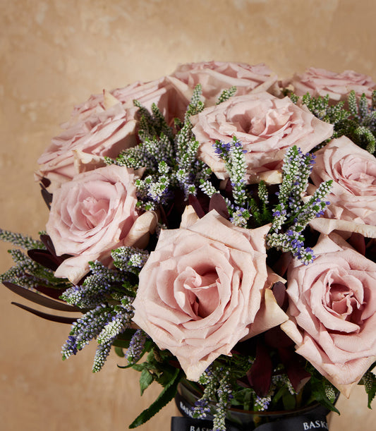 Light pink roses with white and purple baby flowers in elegant vase arrangement, luxury gift hamper from Bangkok florist
