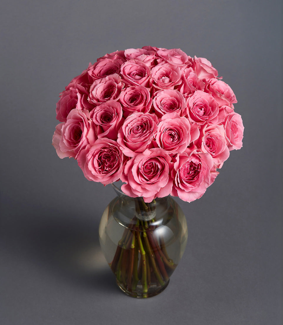 Pink roses and ranunculus in pearl leather flower box, congratulations gift arrangement