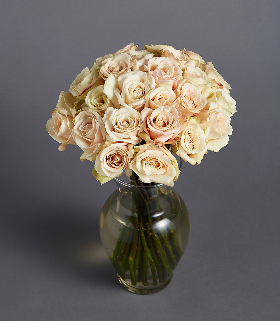 Blush and cream rose bouquet in clear glass vase, timeless elegant floral gift arrangement