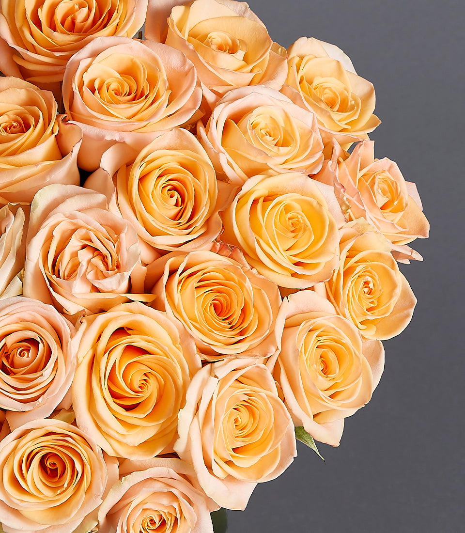 Soft peach roses bouquet with Ecuador-sourced blooms in spiral arrangement