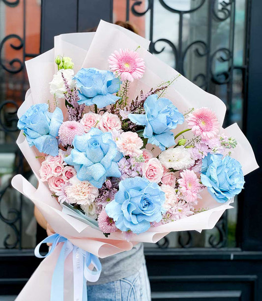Vibrant blue roses and pink gerbera daisies birthday bouquet with premium fresh flowers