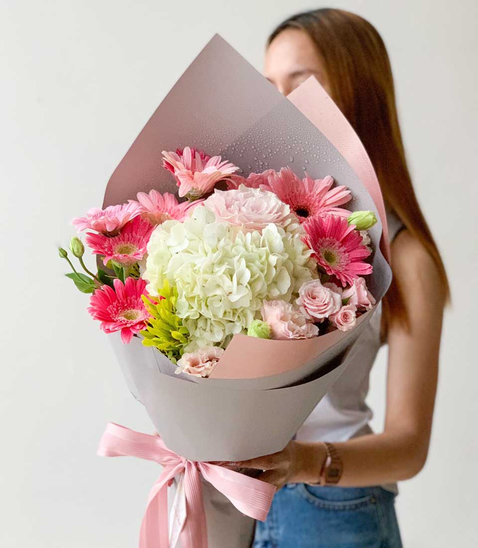 Fresh white hydrangea and pink rose graduation bouquet with grey and blush paper wrap