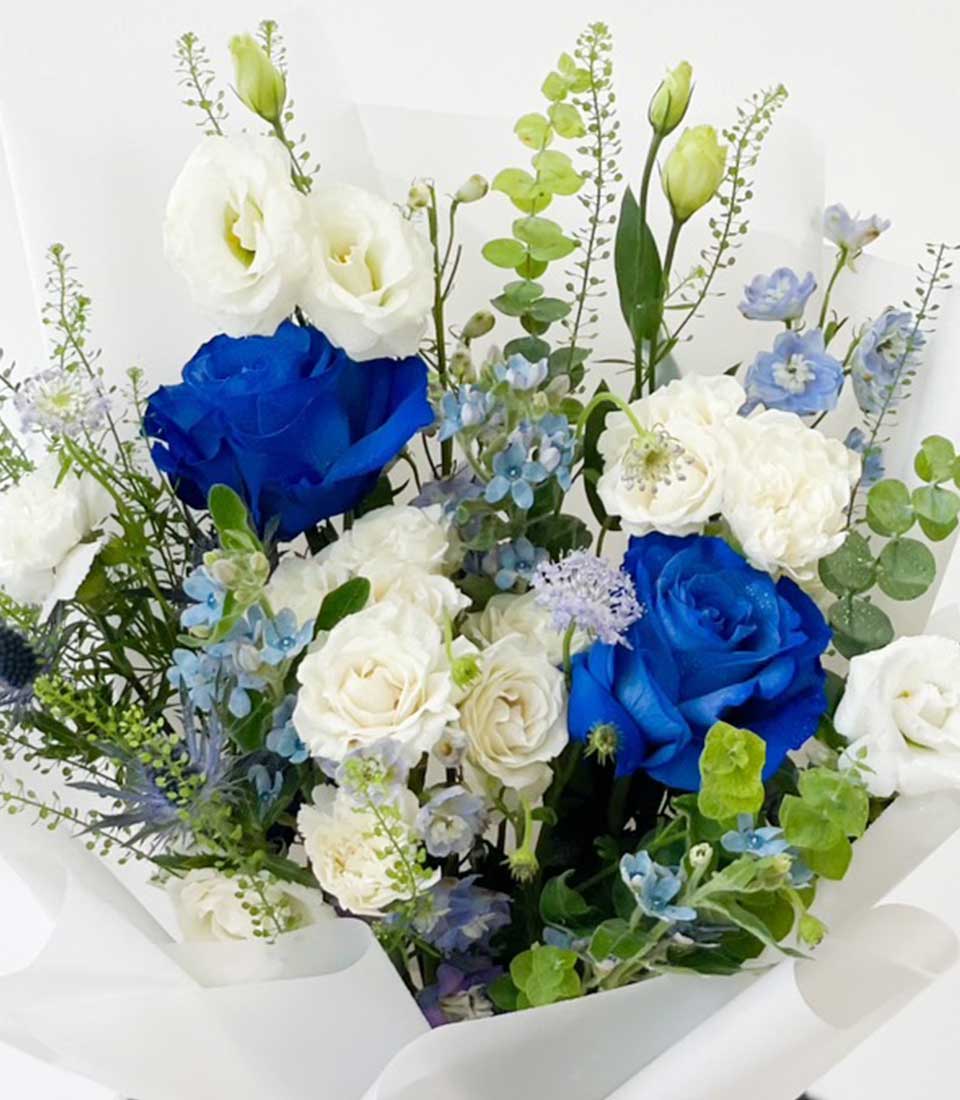 Blue and white rose bouquet with lisianthus, perfect for graduation celebrations