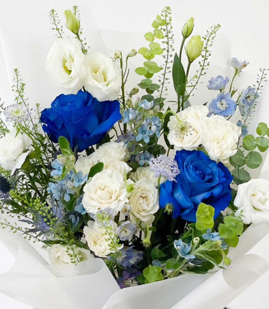 Blue and white rose bouquet with lisianthus, perfect for graduation celebrations