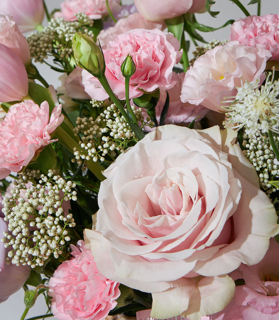 Lavender Bloom premium flower basket with pink roses, carnations, tulips, and white filler flowers