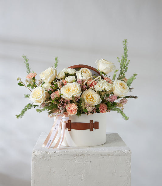 Luxury white and pink rose arrangement in leather-trimmed hatbox with carnations and greenery