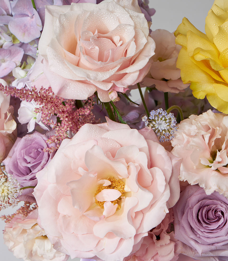 Luxury velvet flower box with yellow, pink and purple roses, hydrangeas and ranunculus for birthday gifting
