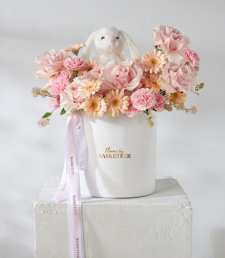 Pink Mondial roses and snow bunny plush in luxury flower box for birthdays