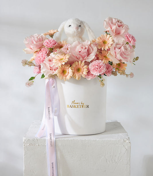 Pink Mondial roses and snow bunny plush in luxury flower box for birthdays
