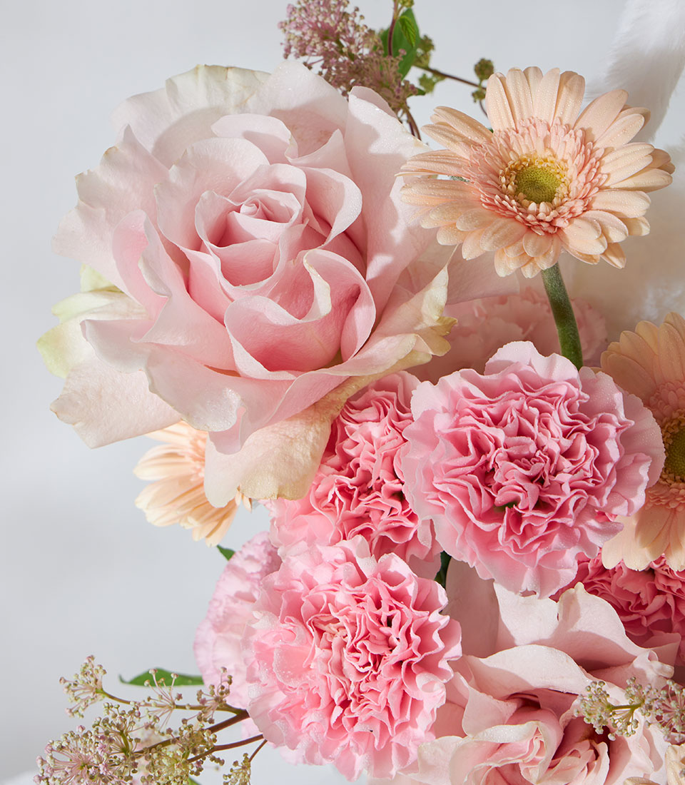 Pink Mondial roses and snow bunny plush in fresh flower birthday gift box