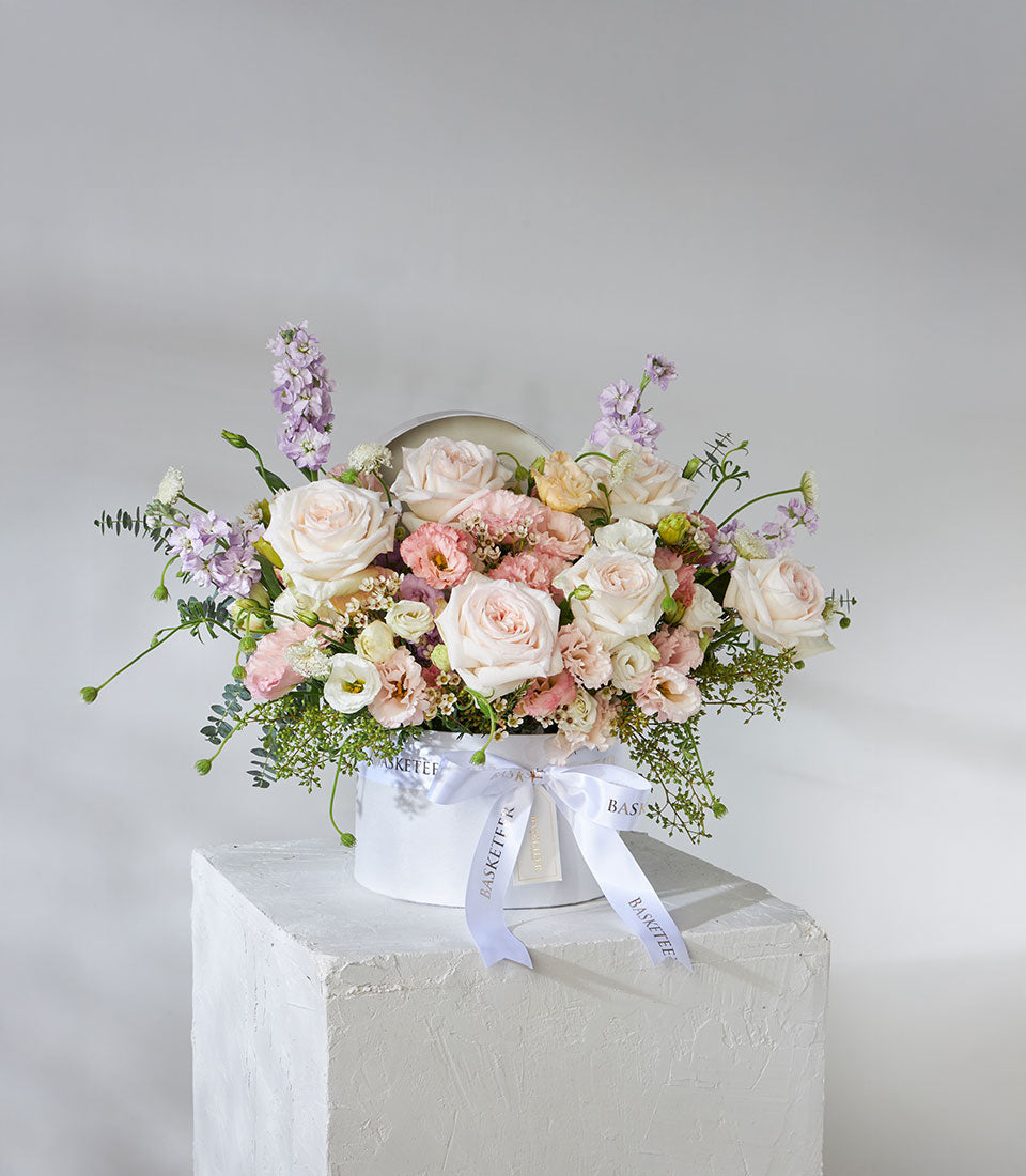 White O'Hara roses and pastel lisianthus in luxury hatbox with ivory ribbon, premium birthday flowers