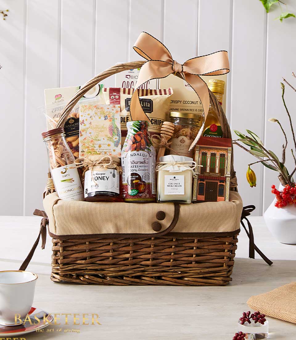 Premium Thai gourmet gift basket with honey, coconut cream, and artisan snacks, tied with gold ribbon