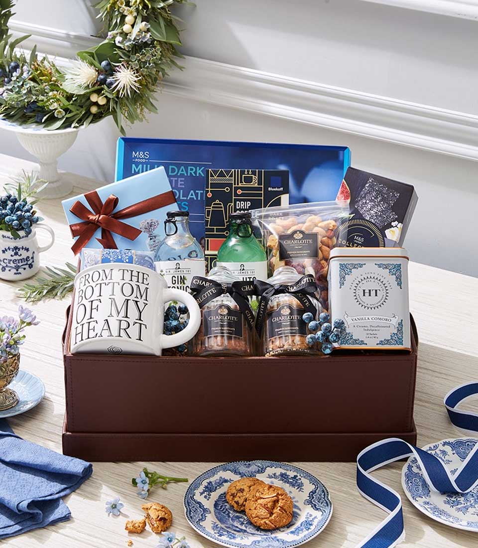 Wholesome Indulgence luxury gift hamper with gin, chocolates, tea, coffee, and gourmet treats in brown leather box