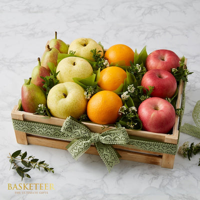 Wooden crate of fresh Asian pears, oranges, and red apples with green ribbon bow, get well gift