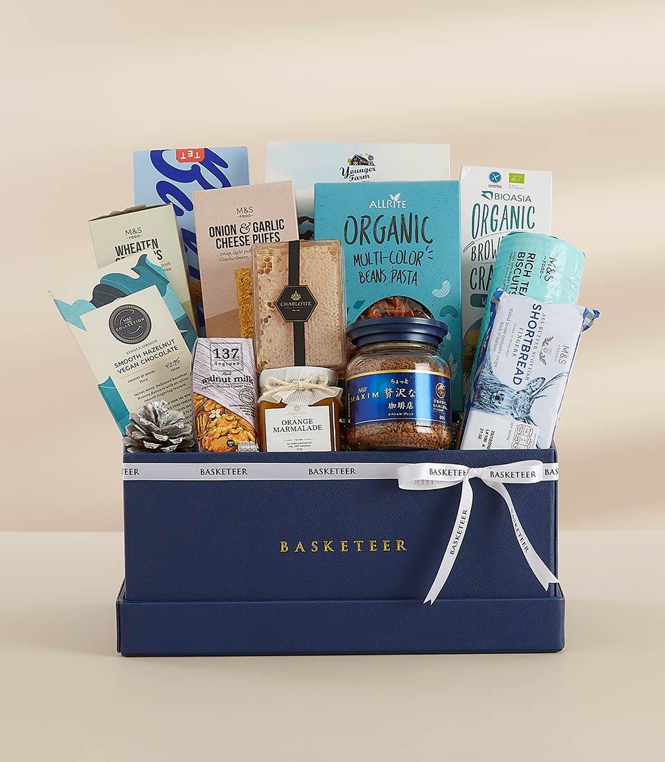Premium New Year gourmet gift hamper with artisan chocolates, pasta, marmalade, and shortbread in navy luxury box