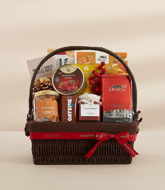 Dark brown woven gift basket filled with gourmet treats, caramel popcorn, jam, cocoa, and chocolate for New Year celebration