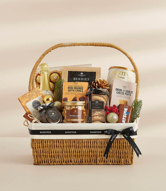 Woven wicker New Year gift hamper with sparkling wine, gourmet chocolates, and artisan treats