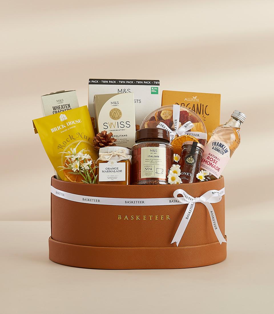 Luxury leather gift basket with gourmet chocolates, coffee, marmalade, and honey for New Year celebrations