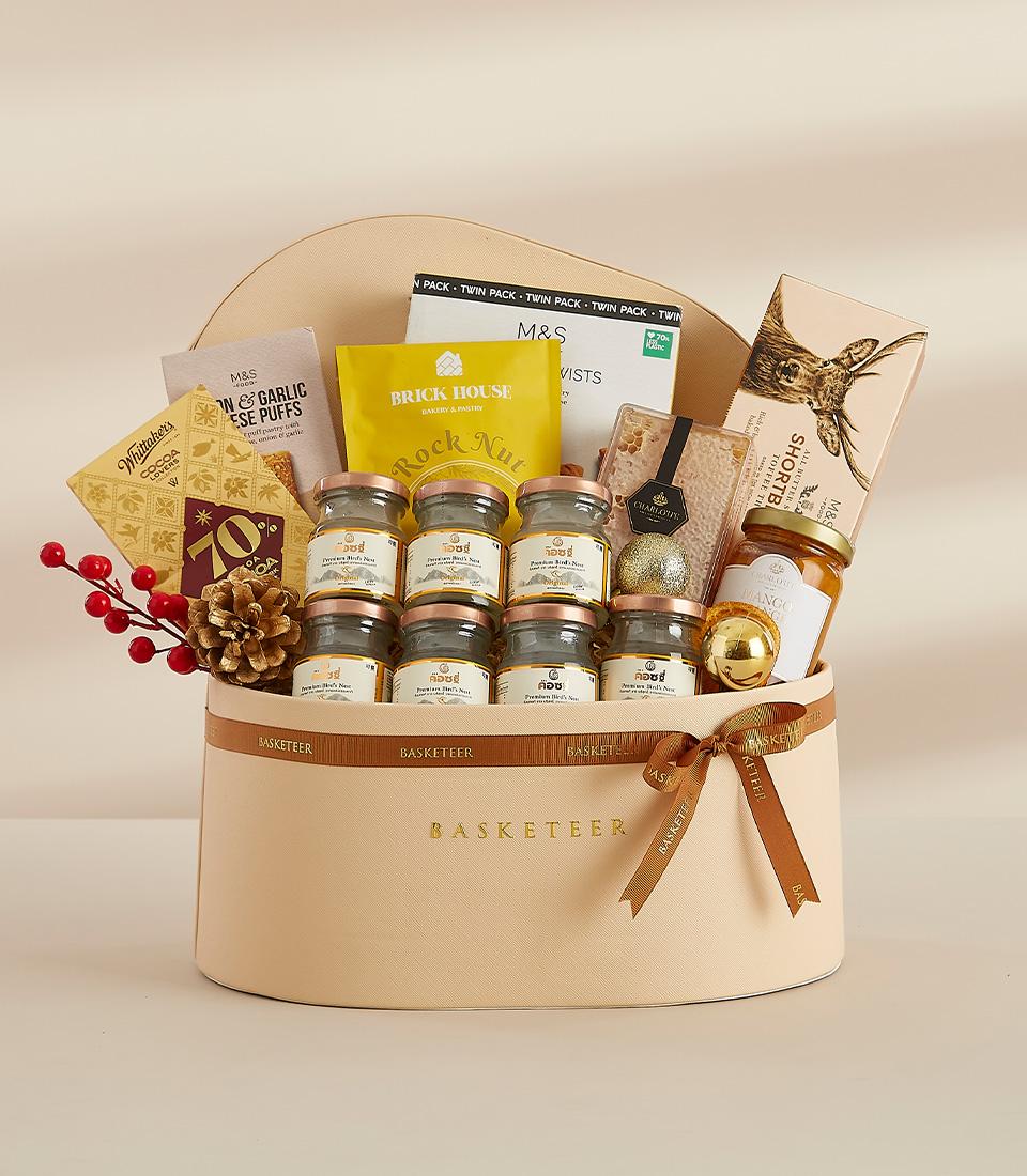Premium New Year gift basket with gourmet treats, honey, nuts, and gold accents in heart-shaped leather box