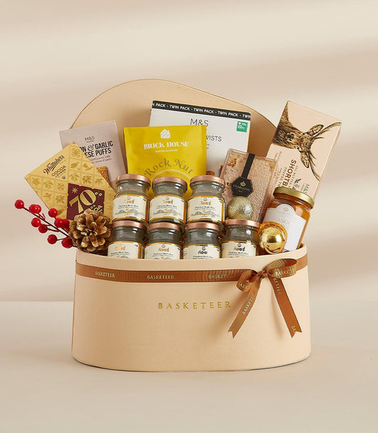 Premium New Year gift basket with gourmet treats, honey, nuts, and gold accents in heart-shaped leather box