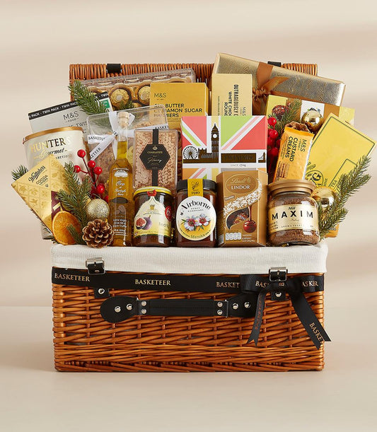 Premium wicker hamper filled with gourmet chocolates, preserves, olive oil, and festive decorations