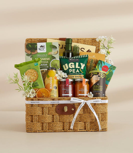 Natural wicker vegan snack hamper with gourmet treats, artisan preserves, and specialty coffee for New Year gifting