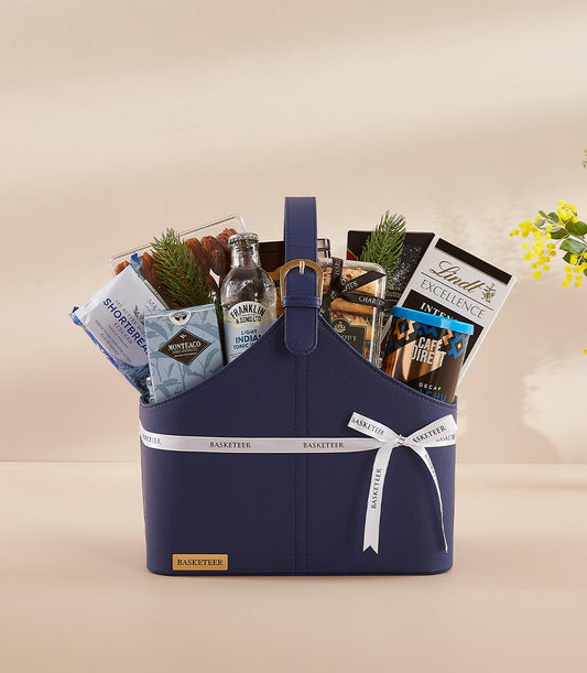 Navy leather gift basket with gourmet chocolates, tea, coffee, and tonic for New Year celebration