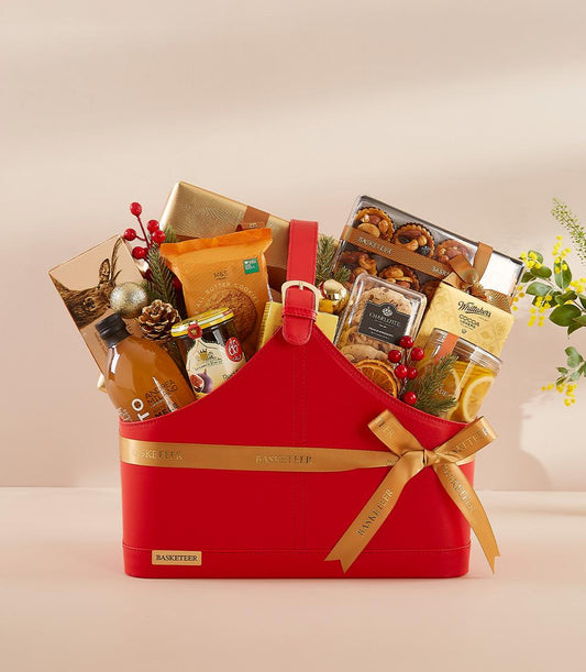 Basketeer luxury gift hamper in a red carrier with treats. Includes cookies, jam, and marmalade. A premium corporate gift for same-day delivery in Bangkok.