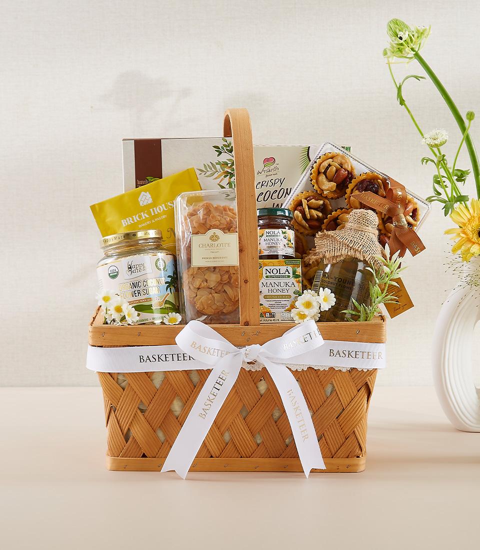 Premium wellness gift basket with organic honey, coconut sugar, and gourmet treats for New Year