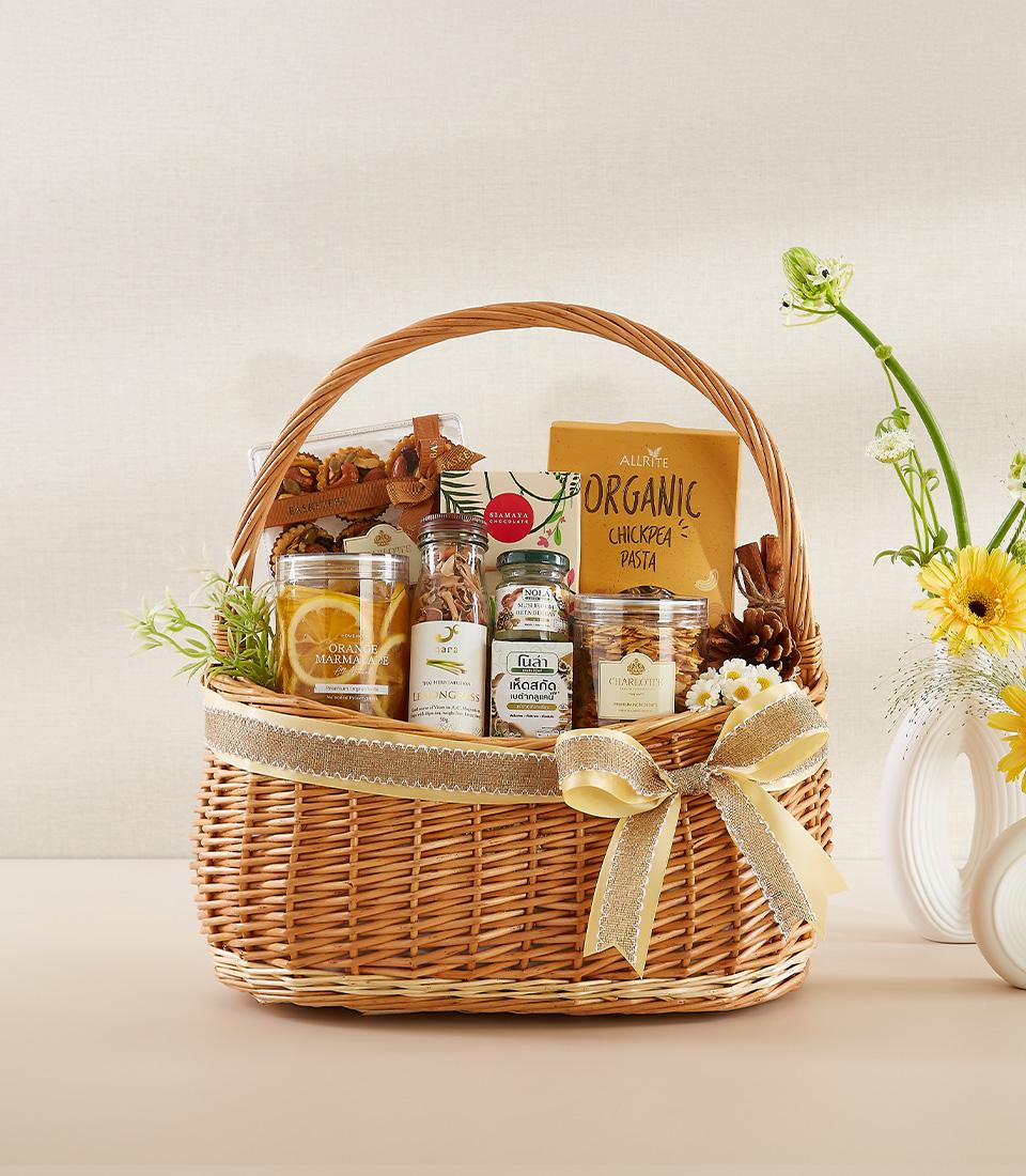 Healthy gourmet gift basket with organic pasta, marmalade, and wellness items, New Year gift with yellow bow