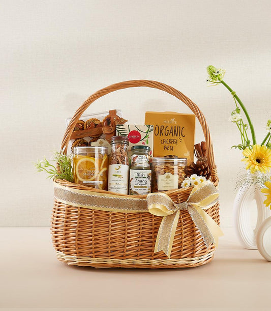 Healthy gourmet gift basket with organic pasta, marmalade, and wellness items, New Year gift with yellow bow