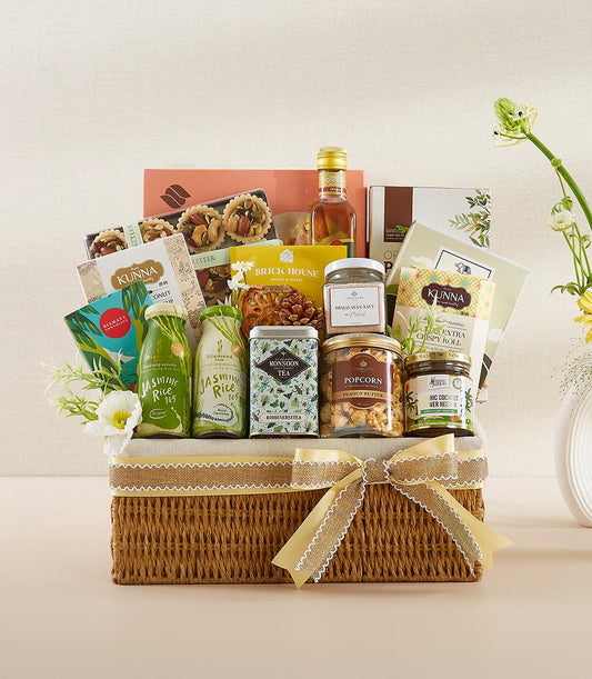 Deluxe Thai gourmet gift basket with jasmine rice, monsoon tea, and artisan snacks in woven basket with yellow ribbon bow
