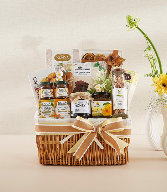 Golden honey and wellness gift basket with gourmet jars, herbal blends, and artisan snacks for New Year