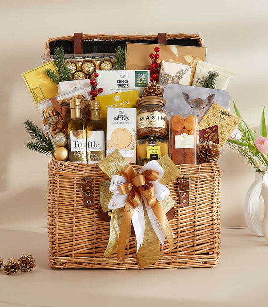 Large wicker gourmet hamper with truffle oil, Ferrero Rocher chocolates, premium cheeses, coffee, and festive seasonal décor