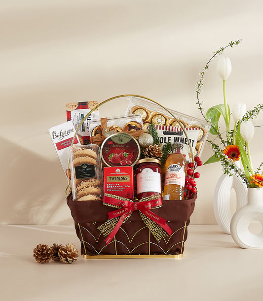 Luxury gold-trimmed gourmet gift hamper with Belgian chocolate, tea, and festive treats for New Year celebrations