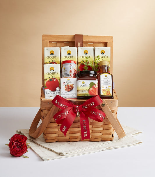 Luxury Doi Kham woven wood gift basket with health & wellness products, red ribbon bow, and artisan gourmet selection