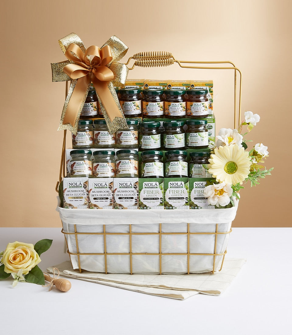 Luxury gold wire gift basket with health wellness products, manuka honey, mushroom beta glucan, and fresh white daisies