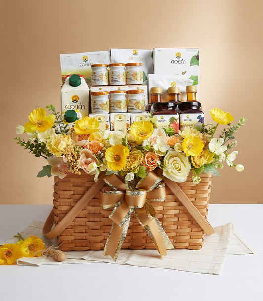 Woven gift basket with Doi Kham gourmet products, green-capped jars, and yellow peach floral arrangement