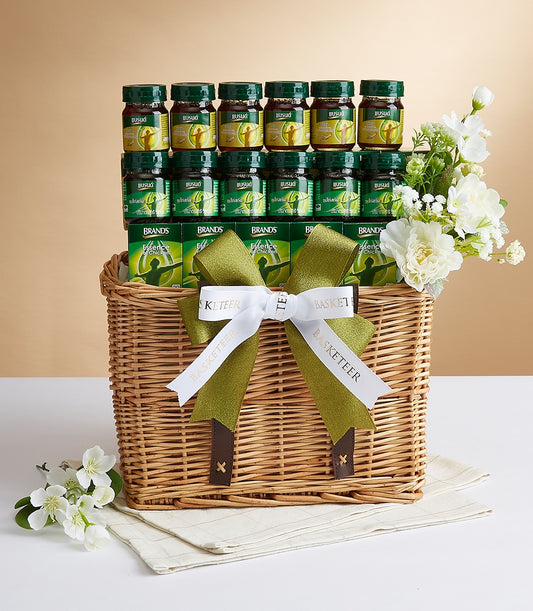 Premium wellness gift basket with chicken essence and health supplements in woven wicker with olive ribbon
