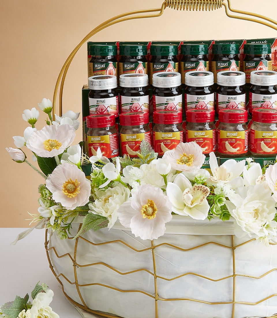 Luxury mixed delicacies gift basket with gourmet bottles and jars, white fabric-lined gold-frame design adorned with white