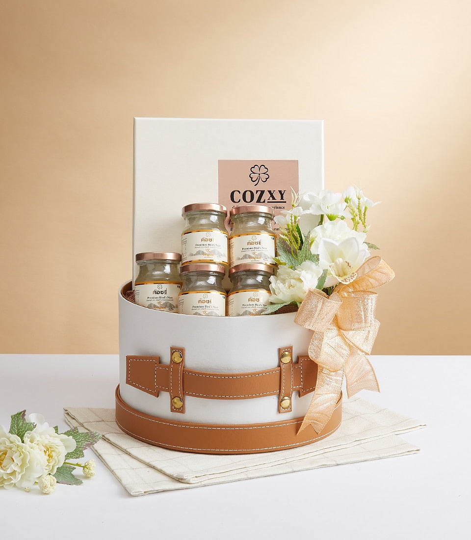 Luxury bird's nest delicacy gift set in white round box with rose gold jar lids and white flowers