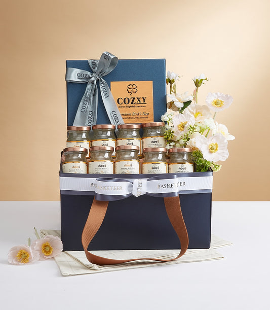 Premium luxury hamper with twelve bird's nest jars, white and yellow flowers, and grey ribbon in dark blue gift box