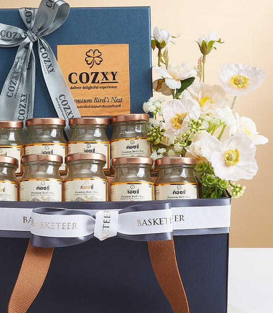 Premium bird's nest luxury hamper with gold-lidded glass jars in dark blue gift box with grey ribbon bow