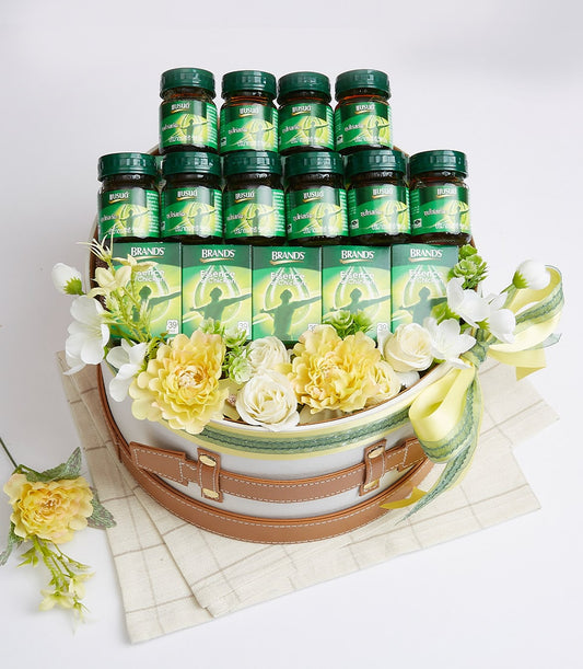 Luxury wellness gift basket with chicken essence supplements and health-focused ingredients in elegant hatbox styling