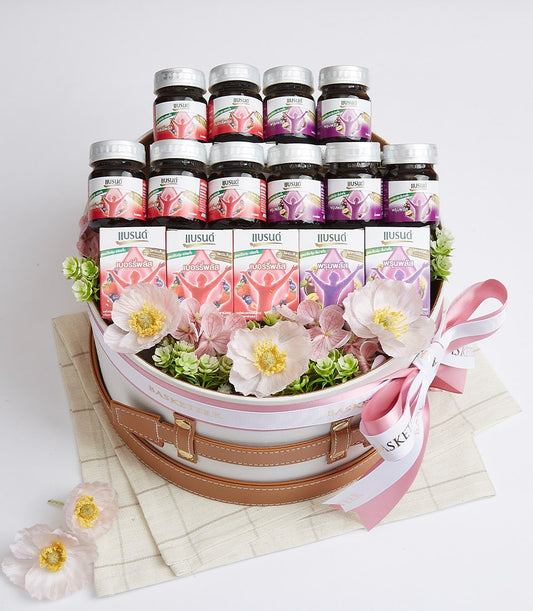 Premium mixed beverage gift basket with wellness drinks, bottled tonics, and artisan health elixirs in white hatbox with
