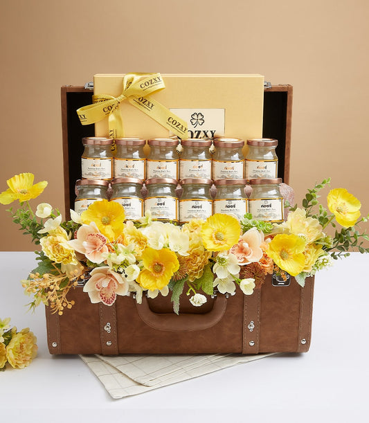 Luxury bird's nest delicacies gift hamper in vintage brown suitcase with golden COZXY box and artisan flowers